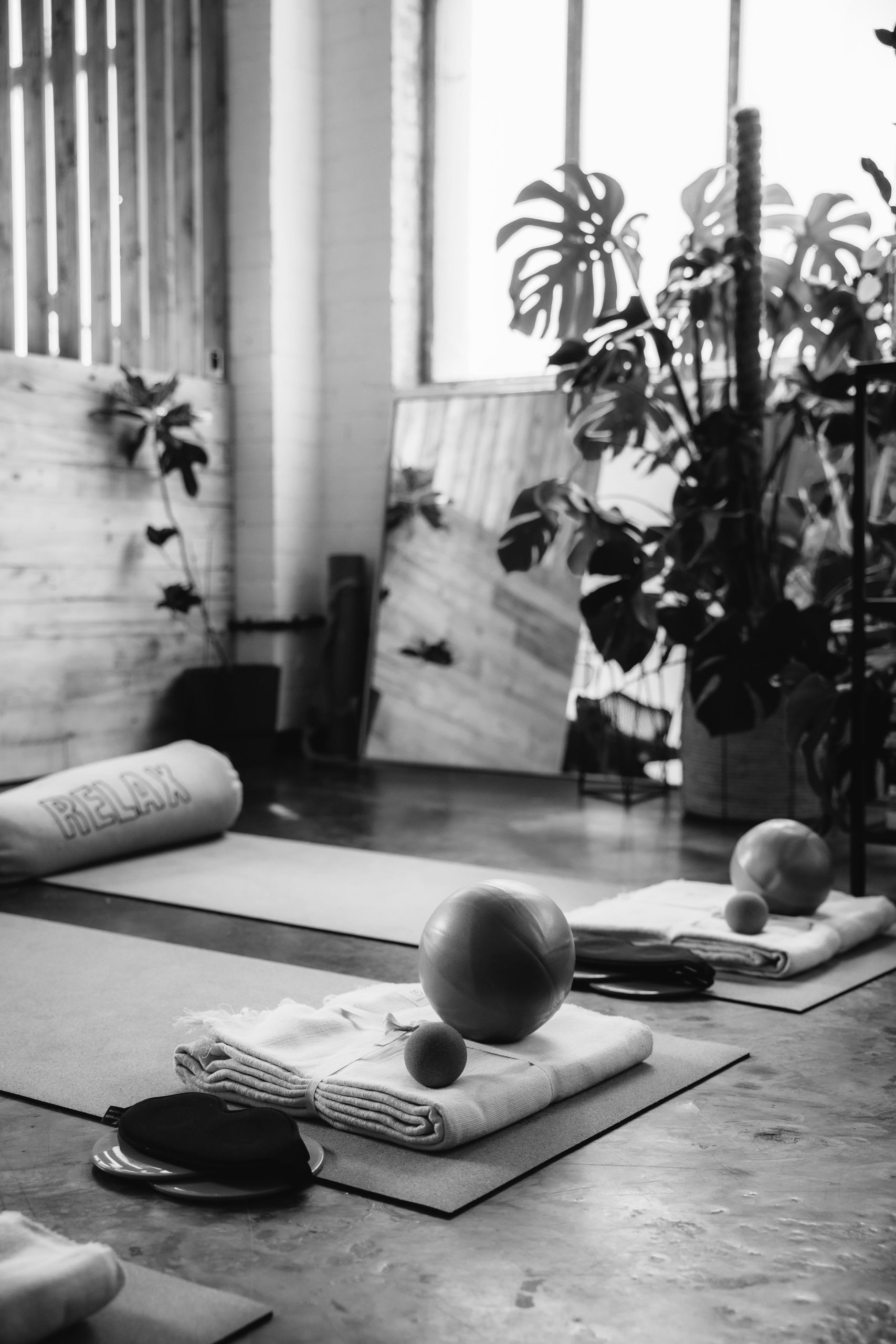 Yoga props, yoga mats, pilates balls and myofascial balls - in a bright studio space — somatic yoga for nervous system regulation and embodied awareness.