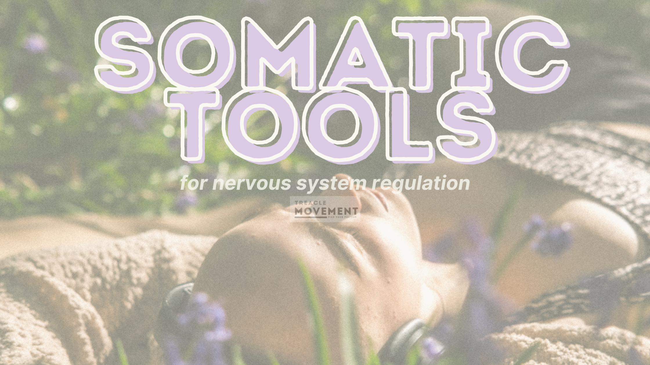 bald woman laying in a field of flowers with headphones on