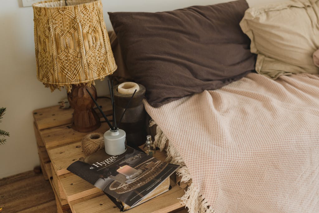 Warm and inviting bedroom setup featuring rustic decor, soft linens, and a cozy ambiance.